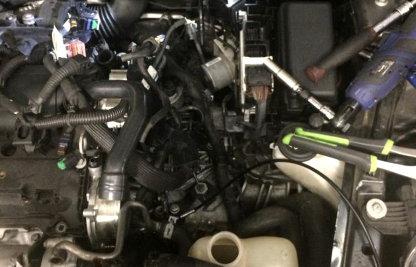 Mid diagnosis engine bay at a Grand Rapids house call