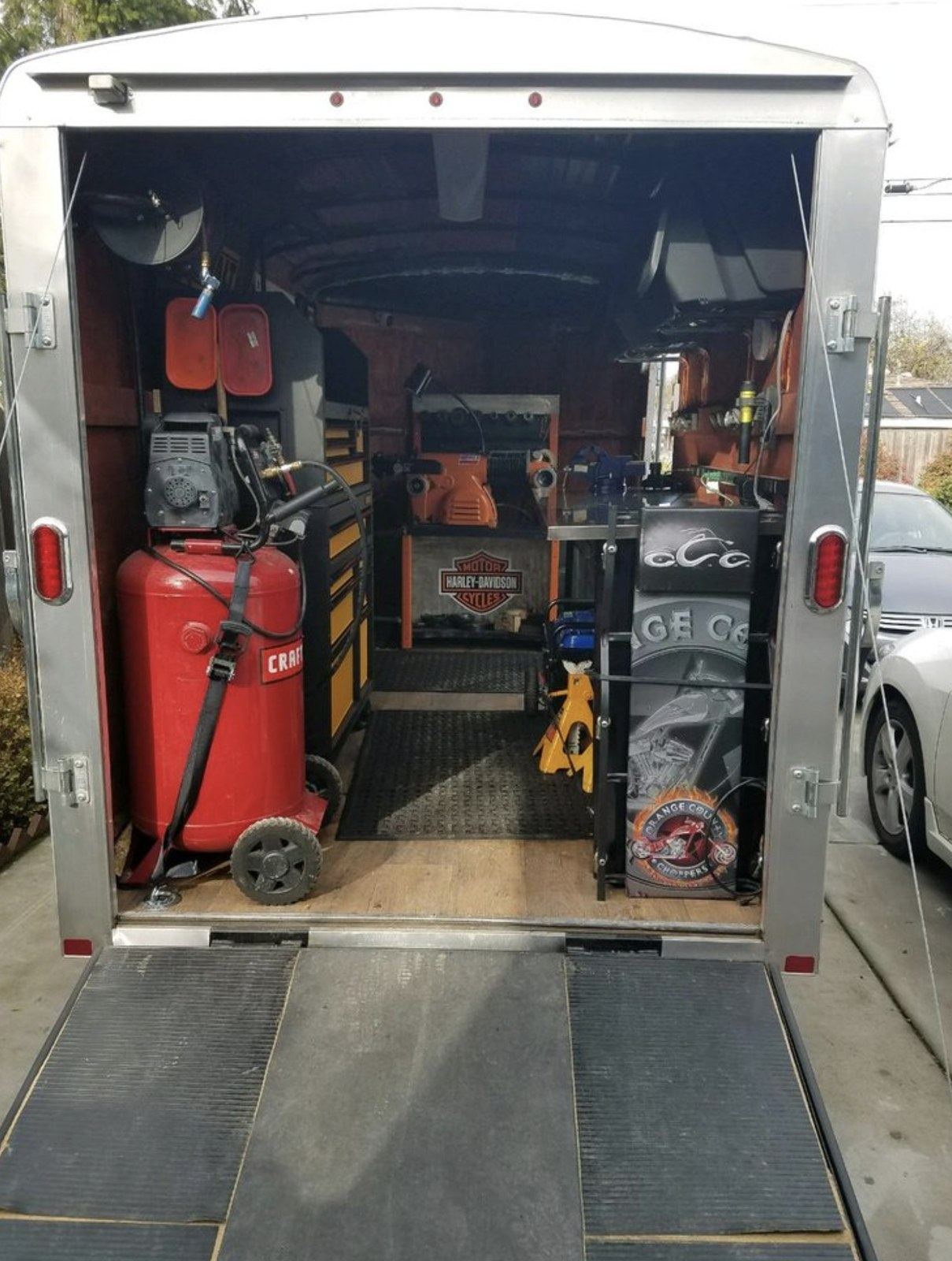 The stocked trailer rig that brings the shop to Grand Rapids driveways